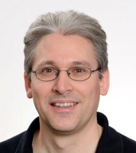 Dr Simon J Allison